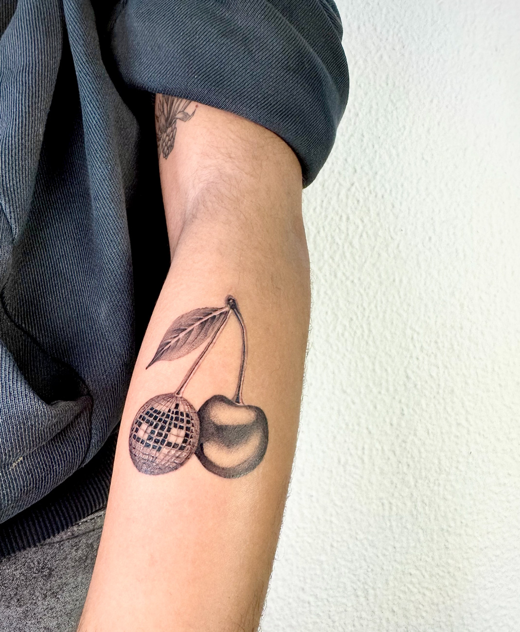 Disco-ball cherries on arm
