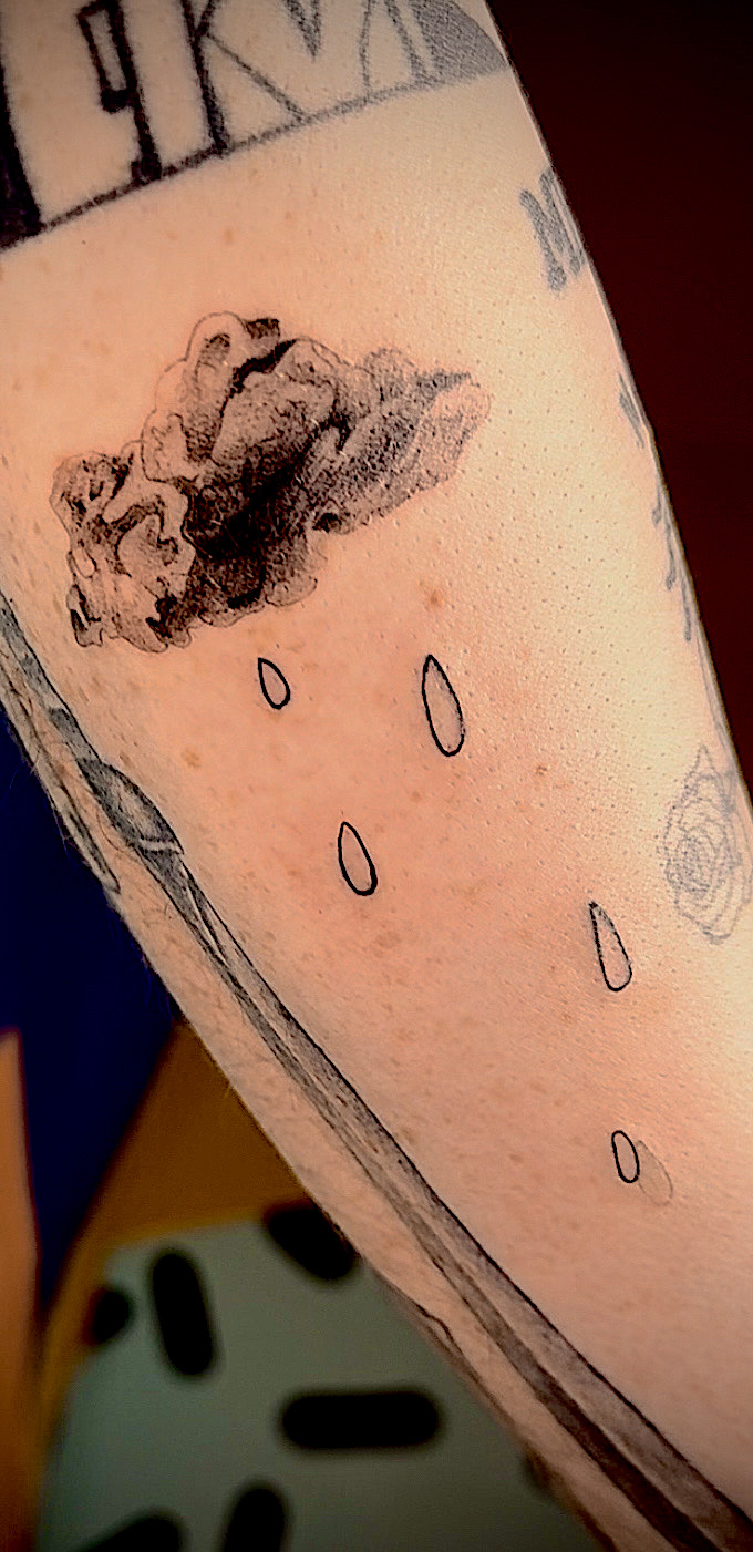 Rainy cloud with droplets on arm