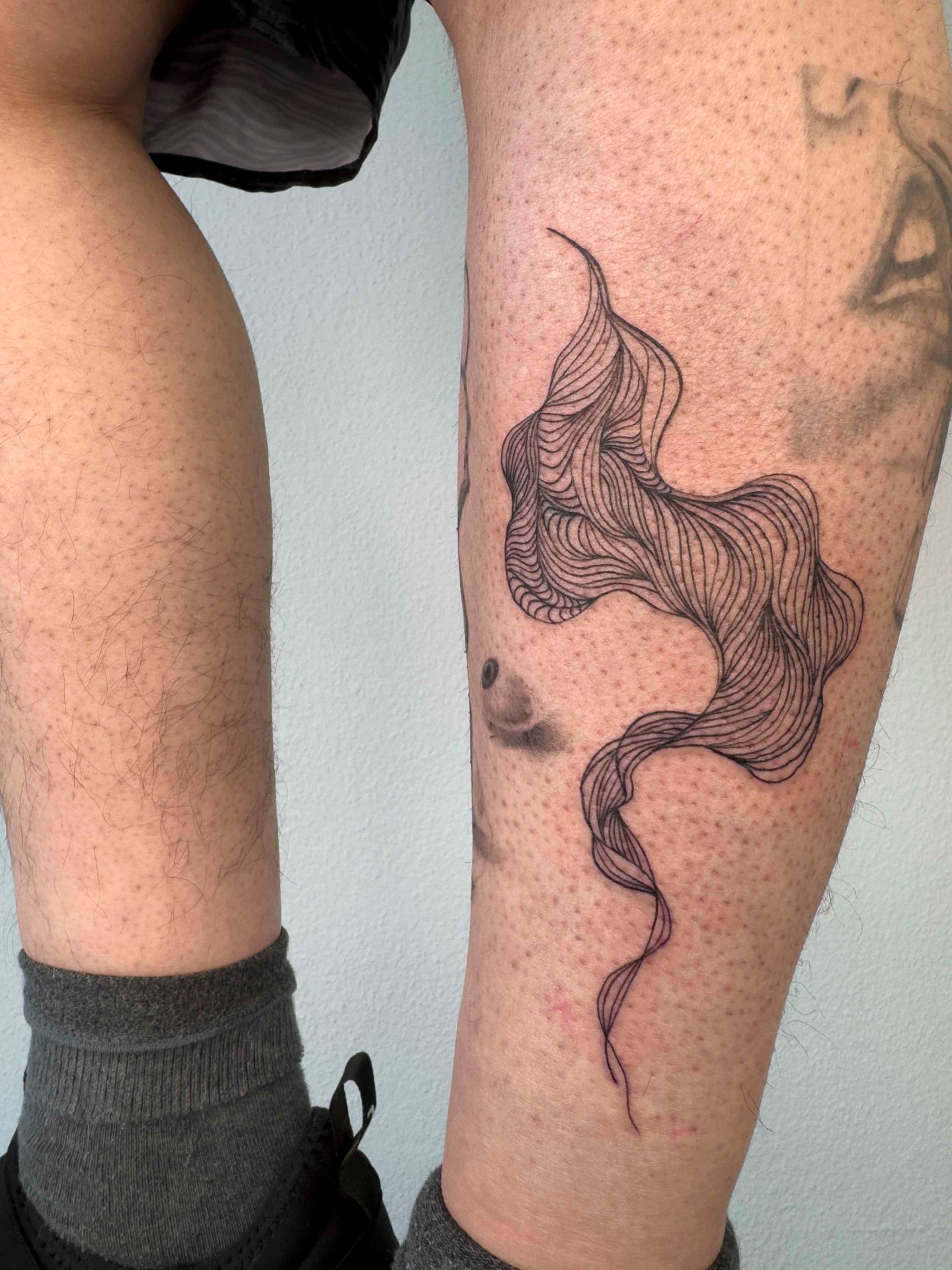 Fine-line wave abstraction on calf
